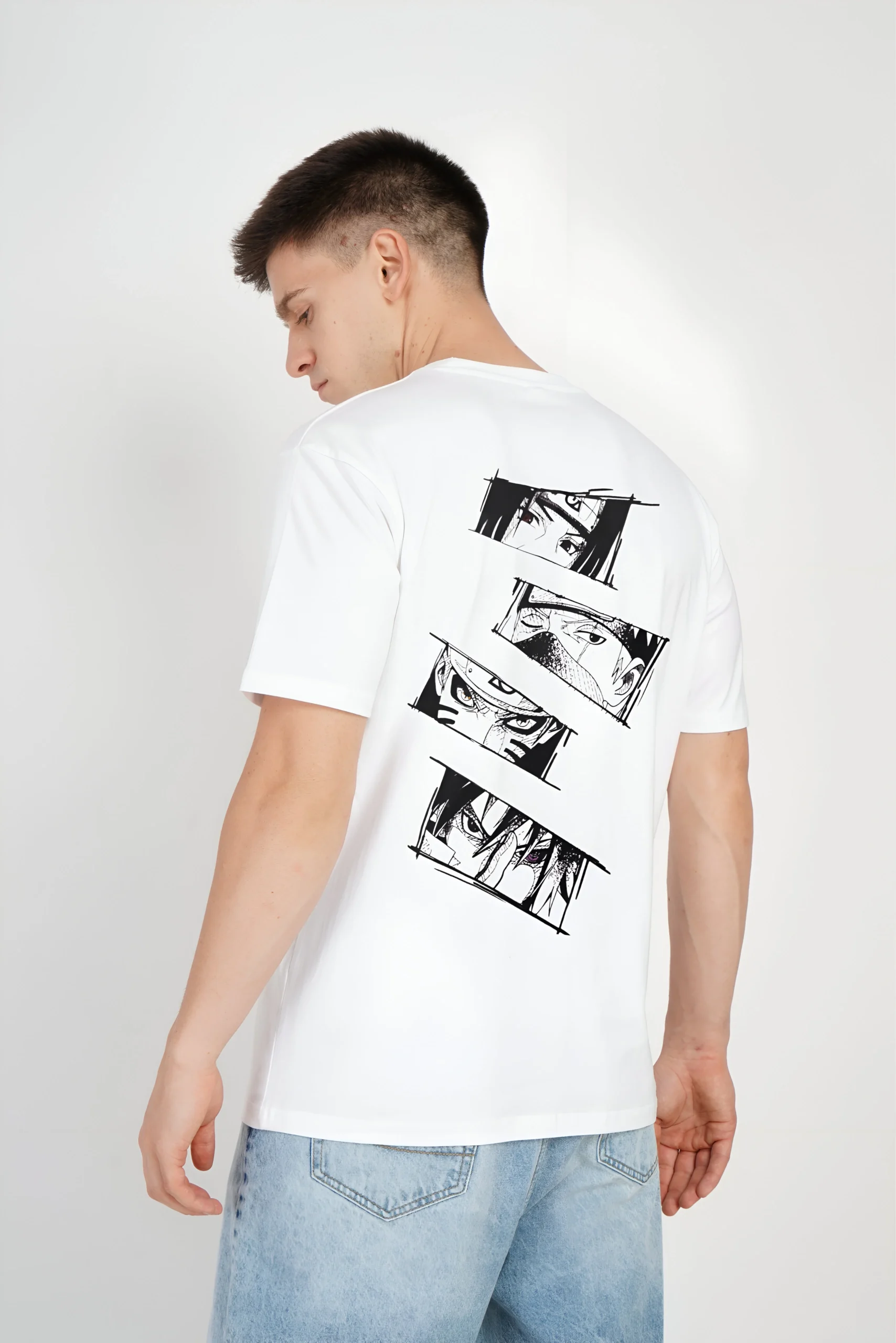 a man wearing a white shirt with a cartoon on it